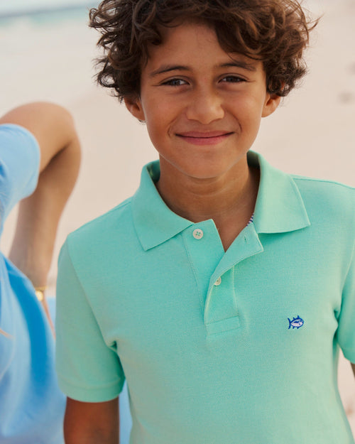 The lifestyle view of the Southern Tide Boys Skipjack Polo by Southern Tide - Gulf Shores